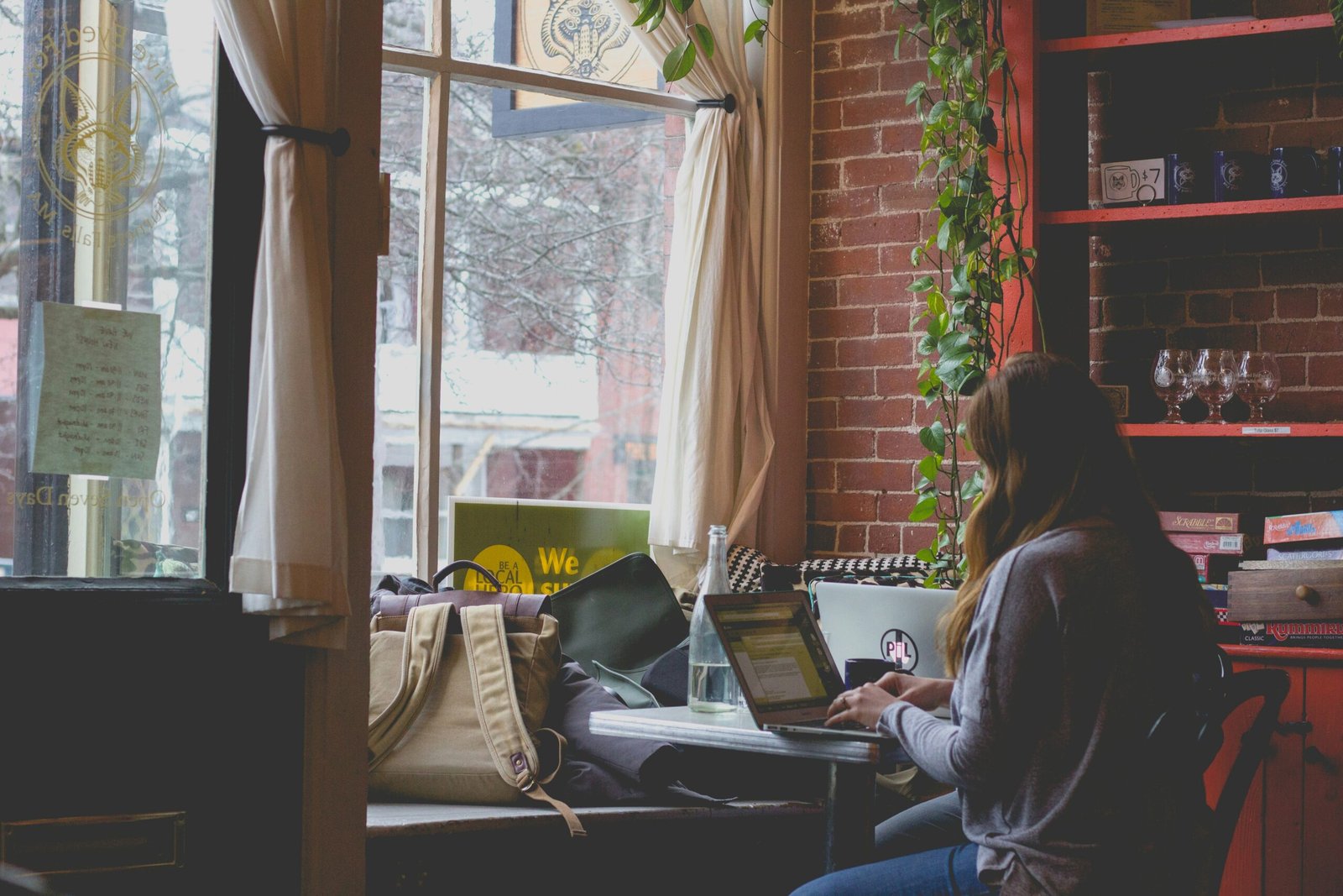 woman working on laptop for KDP self-publishing