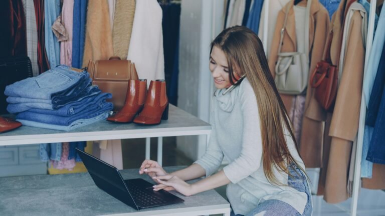 small business owner using Canva templates on laptop